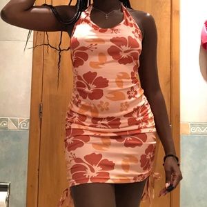 Halter sun dress with flower pattern.